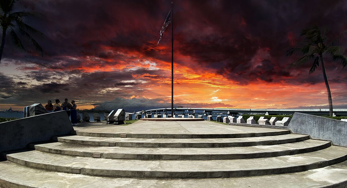 Within sight of the USS Arizona Memorial and USS Missouri